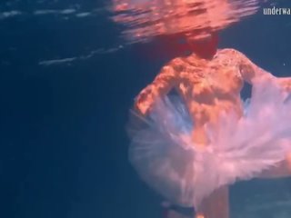 Bulava Lozhkova With a Red Tie and Skirt Underwater